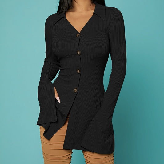 Black ribbed long-sleeve shirt worn by a person on a teal background